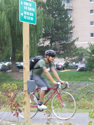 Photo: Counter and Cyclist on Four Mile Run Trail